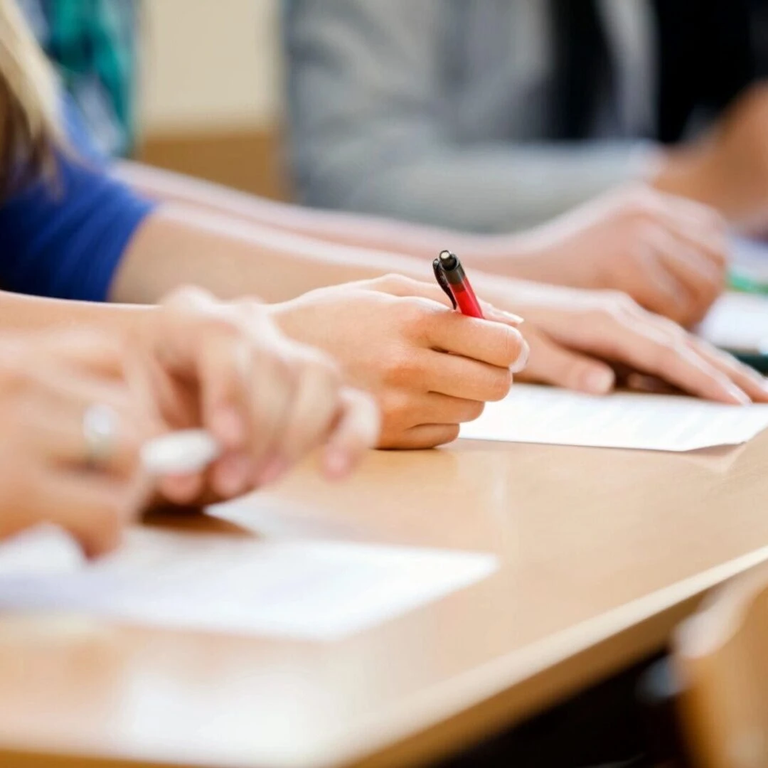 People completing educational crossword puzzles